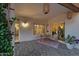 Charming covered patio with cozy seating and outdoor dining space at 6145 E Snowdon St, Mesa, AZ 85215