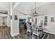 Open-concept dining room with modern decor, hardwood floors, and ample natural light at 6145 E Snowdon St, Mesa, AZ 85215