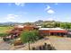 Striking Southwestern architecture with red brick exteriors, desert landscaping and mountain views at 6145 E Snowdon St, Mesa, AZ 85215