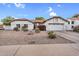 Classic single-Gathering home with a clean, well-kept exterior and spacious driveway under a blue sky at 6145 E Snowdon St, Mesa, AZ 85215