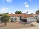 Inviting single-story residence featuring a red tile roof, an attached two-car garage, and a meticulously landscaped front yard at 6145 E Snowdon St, Mesa, AZ 85215