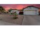 Charming single-Gathering home featuring a well-maintained yard and beautiful desert sunset at 6145 E Snowdon St, Mesa, AZ 85215