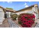 Inviting front entrance with landscaped walkway leading to a well-maintained single Gathering home at 6145 E Snowdon St, Mesa, AZ 85215