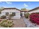Inviting front entrance with landscaped walkway leading to a well-maintained single Gathering home at 6145 E Snowdon St, Mesa, AZ 85215