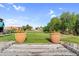 A charming view of the golf course from a wooden bridge with flowers, blending nature and recreation at 6145 E Snowdon St, Mesa, AZ 85215