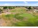 Stunning aerial view of a meticulously maintained golf course with lush fairways and desert landscape at 6145 E Snowdon St, Mesa, AZ 85215