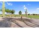 Desert golf course with a sidewalk and large cacti surrounded by mountains and blue skies at 6145 E Snowdon St, Mesa, AZ 85215