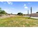 Expansive view of the golf course highlighting the natural desert landscaping and community homes in the distance at 6145 E Snowdon St, Mesa, AZ 85215