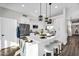 Bright kitchen with white cabinets, stainless steel appliances, and a large center island at 6145 E Snowdon St, Mesa, AZ 85215