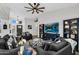 Living room with large TV, display cabinets and open layout, perfect for entertaining at 6145 E Snowdon St, Mesa, AZ 85215