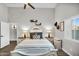 Calm main bedroom features neutral colors, a ceiling fan, and a shuttered window at 6145 E Snowdon St, Mesa, AZ 85215