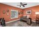 Cozy home office with rustic desk, ample lighting, and charming decorative touches at 6145 E Snowdon St, Mesa, AZ 85215