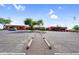 Spacious parking lot leading to the building entrance, adorned with mature trees and easy accessibility at 6145 E Snowdon St, Mesa, AZ 85215