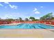 Sparkling community pool with lane markers, lounge seating, and safety flags for enjoyable swimming at 6145 E Snowdon St, Mesa, AZ 85215