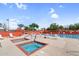 Community pool area with two hot tubs and plenty of lounge chairs for residents to enjoy on a sunny day at 6145 E Snowdon St, Mesa, AZ 85215