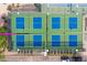 Overhead view of tennis courts featuring blue and green surfaces, surrounded by a fence and desert landscape at 6145 E Snowdon St, Mesa, AZ 85215