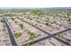 Expansive aerial view of a residential neighborhood with well-maintained homes and green trees at 636 E Redondo Dr, Gilbert, AZ 85296
