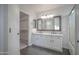 Elegant bathroom featuring double sinks, granite countertops, and sleek cabinetry at 636 E Redondo Dr, Gilbert, AZ 85296