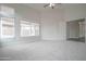 Inviting bedroom featuring plush carpeting, neutral walls, and ample natural light at 636 E Redondo Dr, Gilbert, AZ 85296