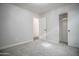 Neutral bedroom features carpeted floor and closet with sliding doors at 636 E Redondo Dr, Gilbert, AZ 85296