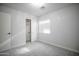 Neutral bedroom featuring carpet, a closet with an open door, and a window with blinds at 636 E Redondo Dr, Gilbert, AZ 85296