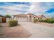Charming home featuring a tile roof, neutral stucco, and a spacious two-car garage at 636 E Redondo Dr, Gilbert, AZ 85296