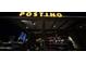 Exterior nighttime view of Postino restaurant, featuring an illuminated sign and outdoor seating at 636 E Redondo Dr, Gilbert, AZ 85296