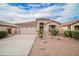Charming single-story home featuring a tile roof, low-maintenance desert landscaping, and an attached garage at 636 E Redondo Dr, Gilbert, AZ 85296