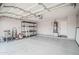Well-organized garage with ample space for parking and storage, featuring shelving at 636 E Redondo Dr, Gilbert, AZ 85296