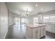 Open concept kitchen showcases a stylish island and seamlessly connects to the adjacent living area at 636 E Redondo Dr, Gilbert, AZ 85296