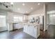 Modern kitchen with granite counters, white cabinets, stainless appliances, and a center island at 636 E Redondo Dr, Gilbert, AZ 85296