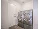 Practical laundry area features modern front load washer and dryer for efficient chore management at 636 E Redondo Dr, Gilbert, AZ 85296