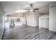 Open-concept living room includes wood-look floors and a kitchen with stainless steel appliances at 636 E Redondo Dr, Gilbert, AZ 85296