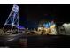 Nighttime view of lighted water tower and Hale Centre Theatre in Gilbert Town Square at 636 E Redondo Dr, Gilbert, AZ 85296