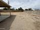 Spacious gravel backyard with a partial view of the house at 6842 S 42Nd Pl, Phoenix, AZ 85042
