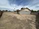 Expansive backyard featuring gravel and a covered patio, perfect for outdoor activities at 6842 S 42Nd Pl, Phoenix, AZ 85042