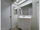 Bright bathroom with a single sink vanity and a large mirror at 6842 S 42Nd Pl, Phoenix, AZ 85042