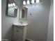 Bathroom featuring a vanity sink, framed mirror, and lighting fixtures at 6842 S 42Nd Pl, Phoenix, AZ 85042