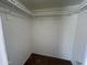 An empty closet with hanging rods, ready for storage and organization at 6842 S 42Nd Pl, Phoenix, AZ 85042