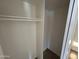 A bright, empty closet with a rod for hanging clothes, ready for storage and organization at 6842 S 42Nd Pl, Phoenix, AZ 85042