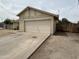 Detached garage with ample parking space and a driveway, offering convenient access at 6842 S 42Nd Pl, Phoenix, AZ 85042