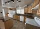Spacious kitchen with bright cabinetry, tile backsplash, and modern lighting at 6842 S 42Nd Pl, Phoenix, AZ 85042