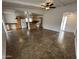 Open living area showcasing the kitchen, dining, and living spaces with natural light at 6842 S 42Nd Pl, Phoenix, AZ 85042