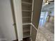 A spacious pantry in the kitchen with ample shelving, providing organized storage for groceries and kitchen essentials at 6842 S 42Nd Pl, Phoenix, AZ 85042