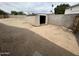 Backyard shed, surrounded by a block wall and gravel at 6842 S 42Nd Pl, Phoenix, AZ 85042