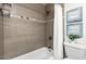 Cozy bathroom featuring a bathtub, shower, and decorative art creating a tranquil and soothing atmosphere at 6923 E Hubbell St, Scottsdale, AZ 85257