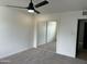 A bright bedroom features neutral carpet and a sliding mirror closet, offering ample storage space at 6923 E Hubbell St, Scottsdale, AZ 85257