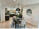 Spacious dining area featuring modern light fixture, seating for four, and stylish decor at 6923 E Hubbell St, Scottsdale, AZ 85257