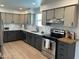 Well-appointed kitchen featuring modern appliances, granite counters and updated cabinets and backsplash at 6923 E Hubbell St, Scottsdale, AZ 85257