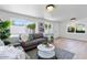 Spacious living room with hardwood floors, bright windows, and modern furnishings, ideal for relaxation and gatherings at 6923 E Hubbell St, Scottsdale, AZ 85257